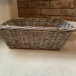 Natural wicker / rattan hamper shown empty from the side