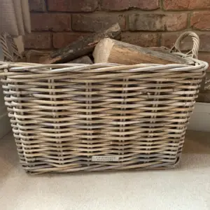 Rattan basket filled with logs